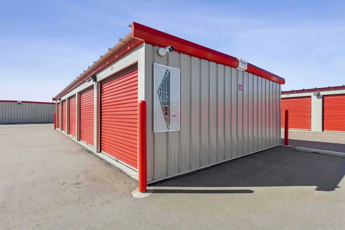 Otter Self Storage in Calgary facility showing building corner with map, security camera, and self storage units